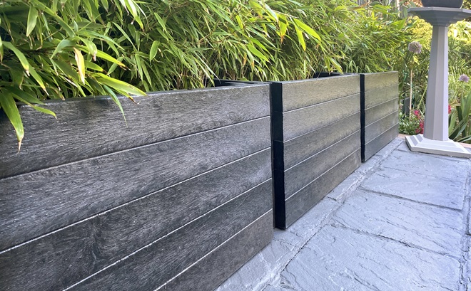 Tall planters in a garden